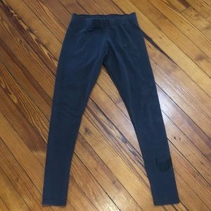 Gray Nike Cotton/Polyester Leggings with black Nike check on left leg